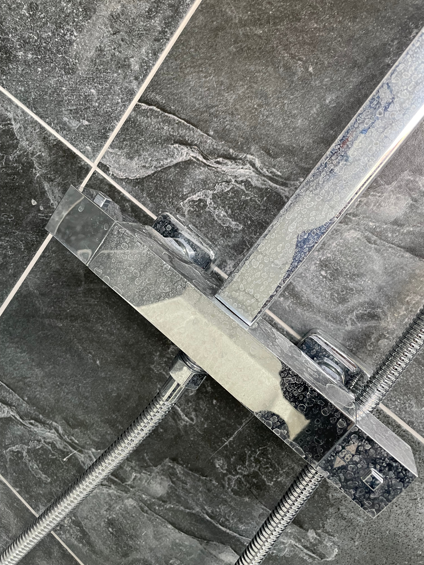 Shower mixer before clean — water spots & limescale