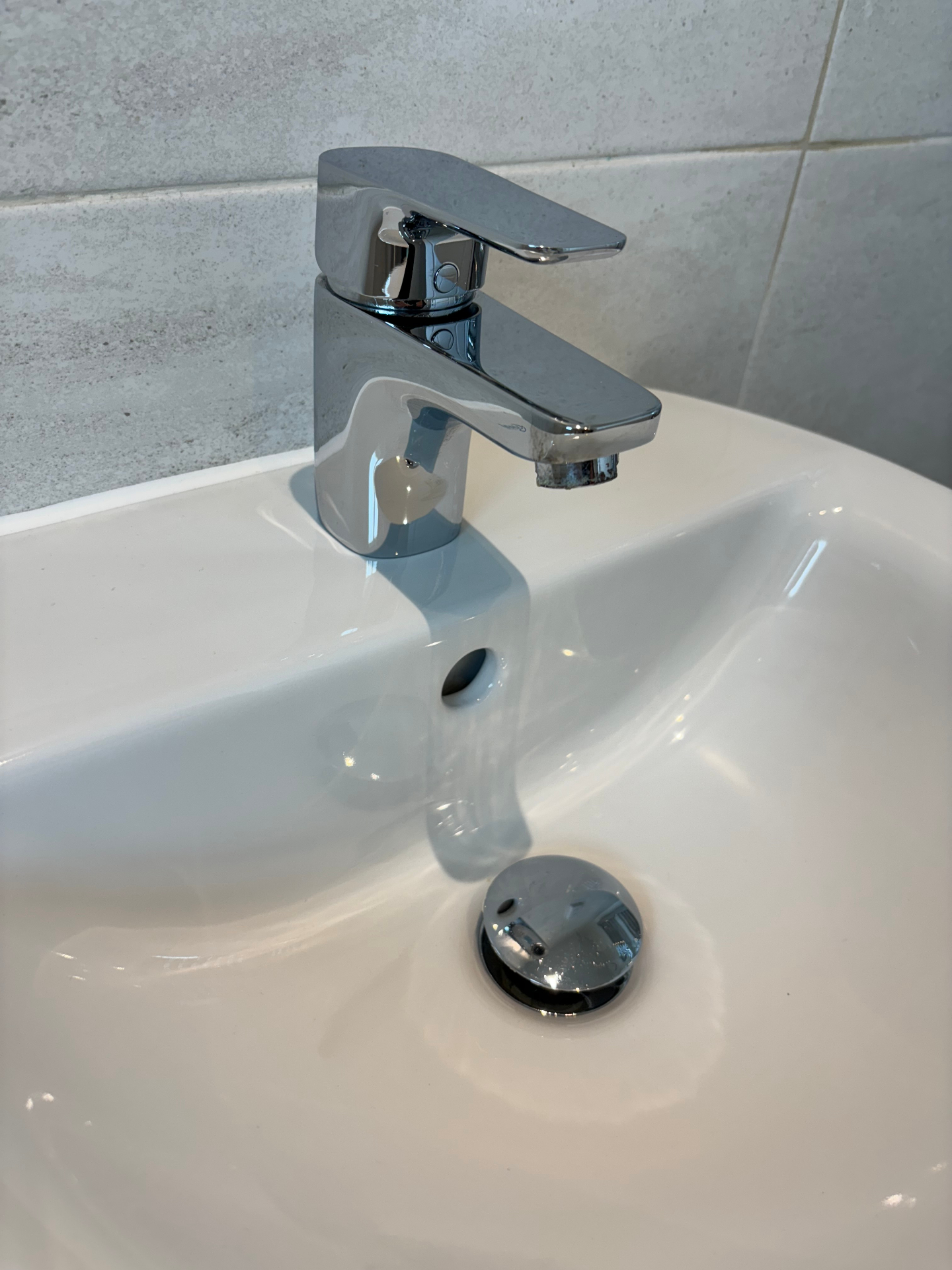 Bathroom sink after deep clean — sparkling chrome