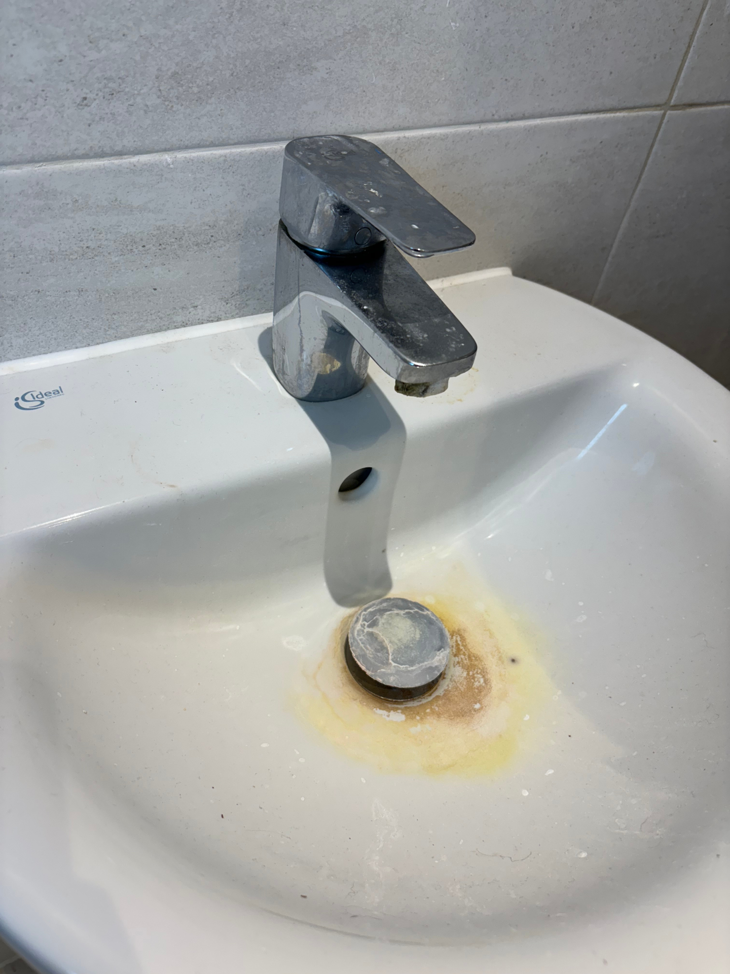 Bathroom sink before deep clean — limescale & stains